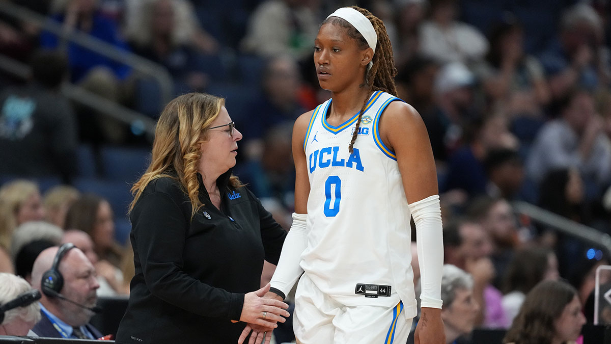 UCLA Bruins forward Janiah Barker (0) high fives head coach Cori Close during the fourth quarter in a semifinal of the women's 2025 NCAA tournament against the Connecticut Huskies at Amalie Arena.