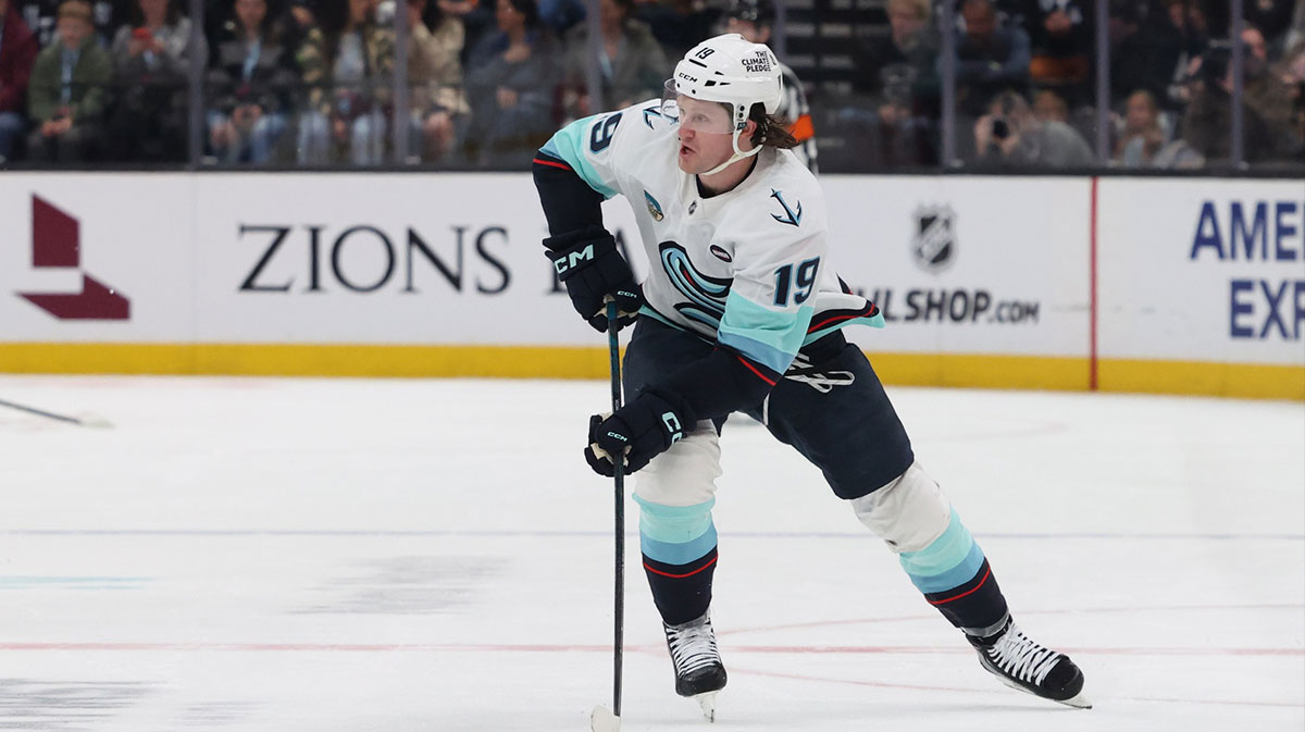 Seattle Kraken left wing Jared McCann (19) skates with the puck against Utah Hockey Club during the first period at Delta Center.