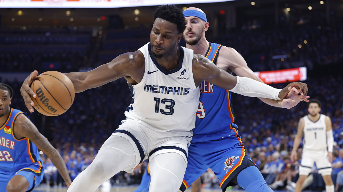 Memphis Grizzlies forward Jaren Jackson Jr. (13) moves the ball against Oklahoma City Thunder guard Alex Caruso (9) in the third quarter during game two of first round for the 2024 NBA Playoffs at Paycom Center.