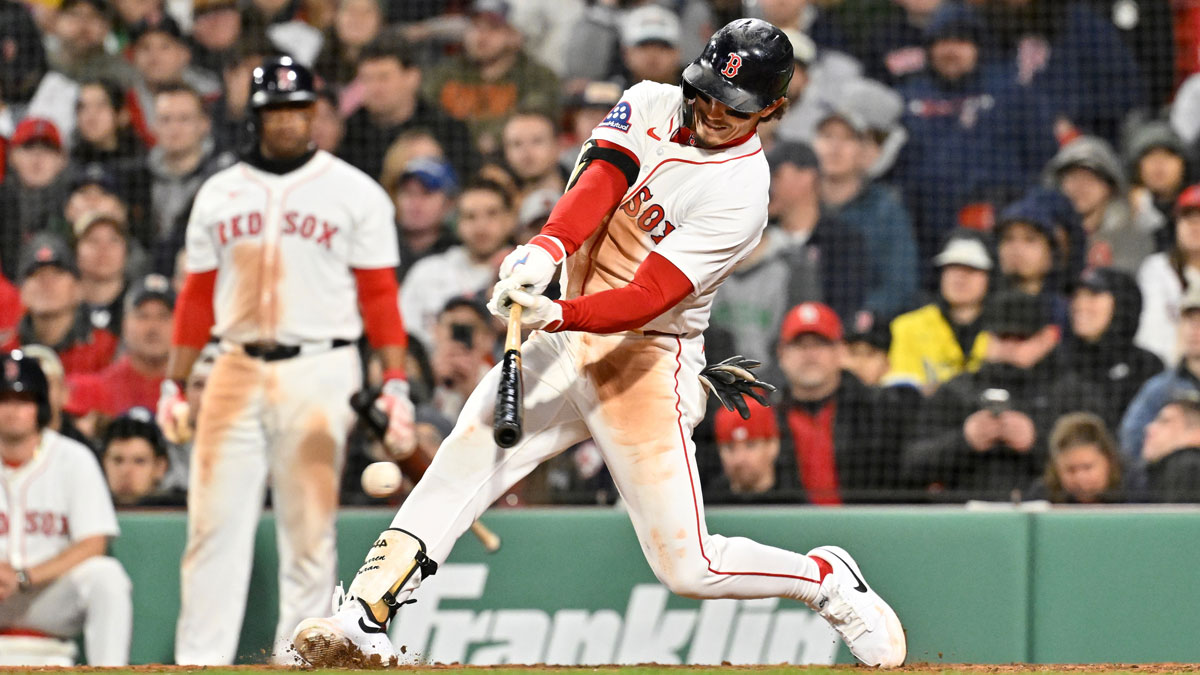 Boston Red Sox left fielder Jarren Duran (16) hits a double against the St. Louis Cardinals during the fifth inning at Fenway Park.