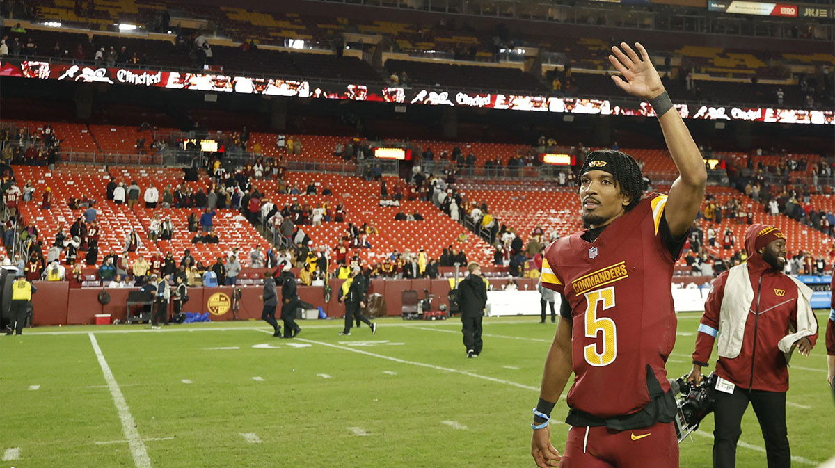 Washington Commanders quarterback Jayden Daniels (5) celebrates while leaving the field after the Commanders' game against the Atlanta Falcons at Northwest Stadium