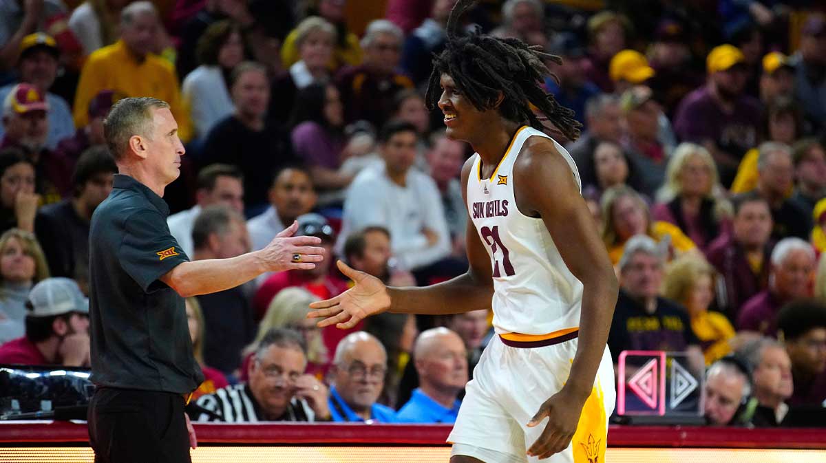 ASU head coach Bobby Hurley high-fives center Jayden Quaintance (21) as he comes to the bench during a game at Desert Financial Arena in Tempe on Jan. 25, 2025.