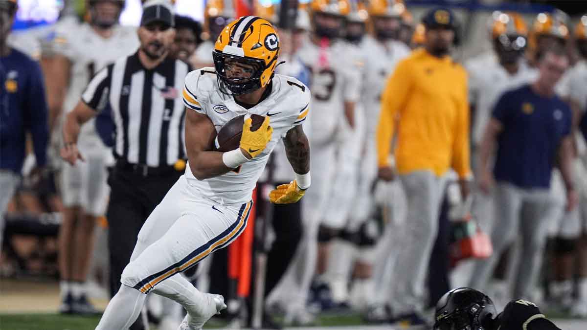 California Golden Bears running back Jaydn Ott (1) eludes Wake Forest Demon Deacons defensive back Zamari Stevenson (17) during the first half at Allegacy Federal Credit Union Stadium.