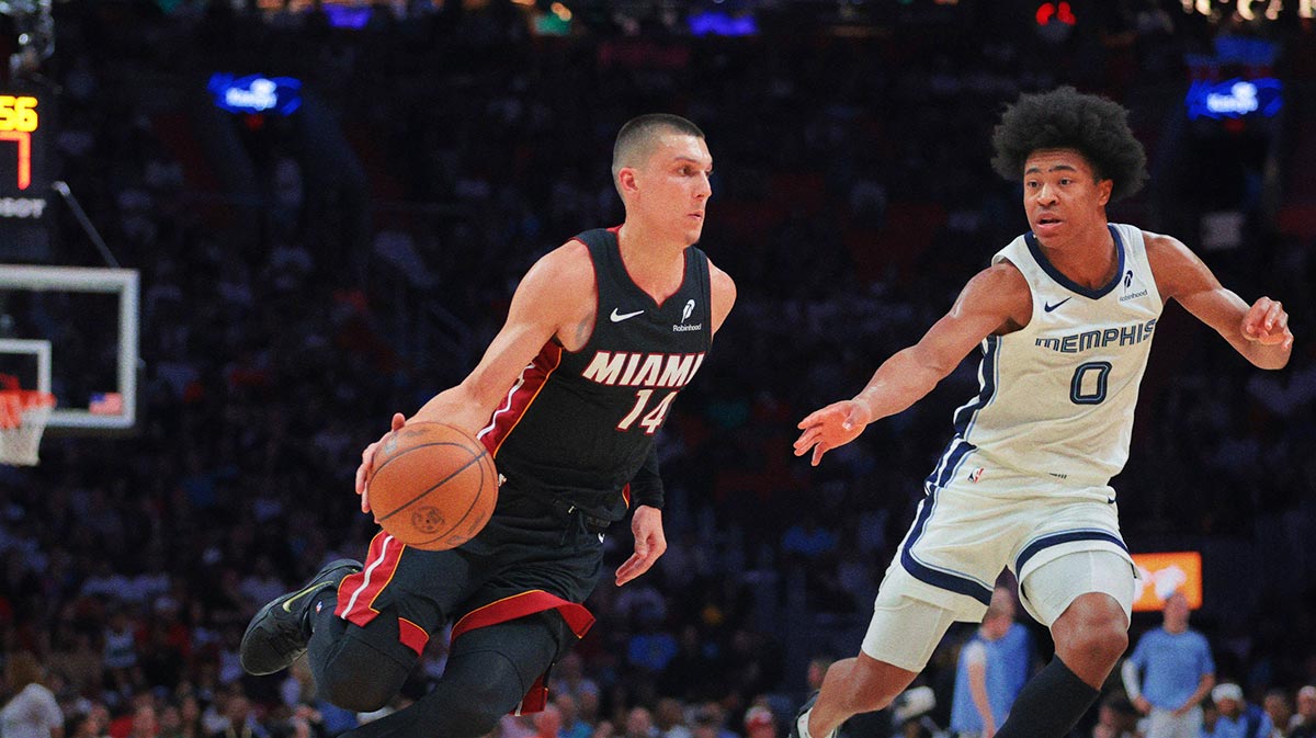 Miami Heat guard Tyler Herro (14) drives to the basket against Memphis Grizzlies forward Jaylen Wells (0) during the third quarter at Kaseya Center.