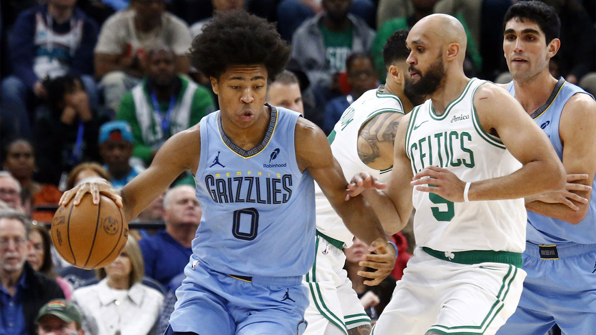Memphis Grizzlies forward Jaylen Wells (0) dribbles as Boston Celtics guard Derrick White (9) defends during the second quarter at FedExForum.