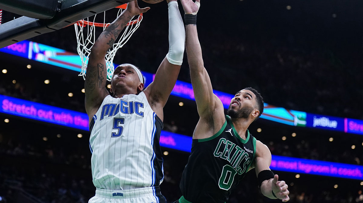 Boston Celtics forward Jayson Tatum (0) defends against Orlando Magic forward Paolo Banchero (5) in the second quarter during game five of first round for the 2025 NBA Playoffs at TD Garden.