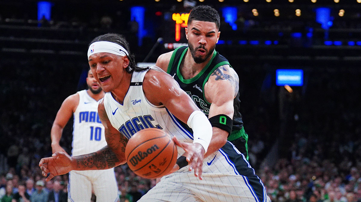 Boston Celtics forward Jayson Tatum (0) defends against Orlando Magic forward Paolo Banchero (5) in the second quarter during game five of first round for the 2025 NBA Playoffs at TD Garden.
