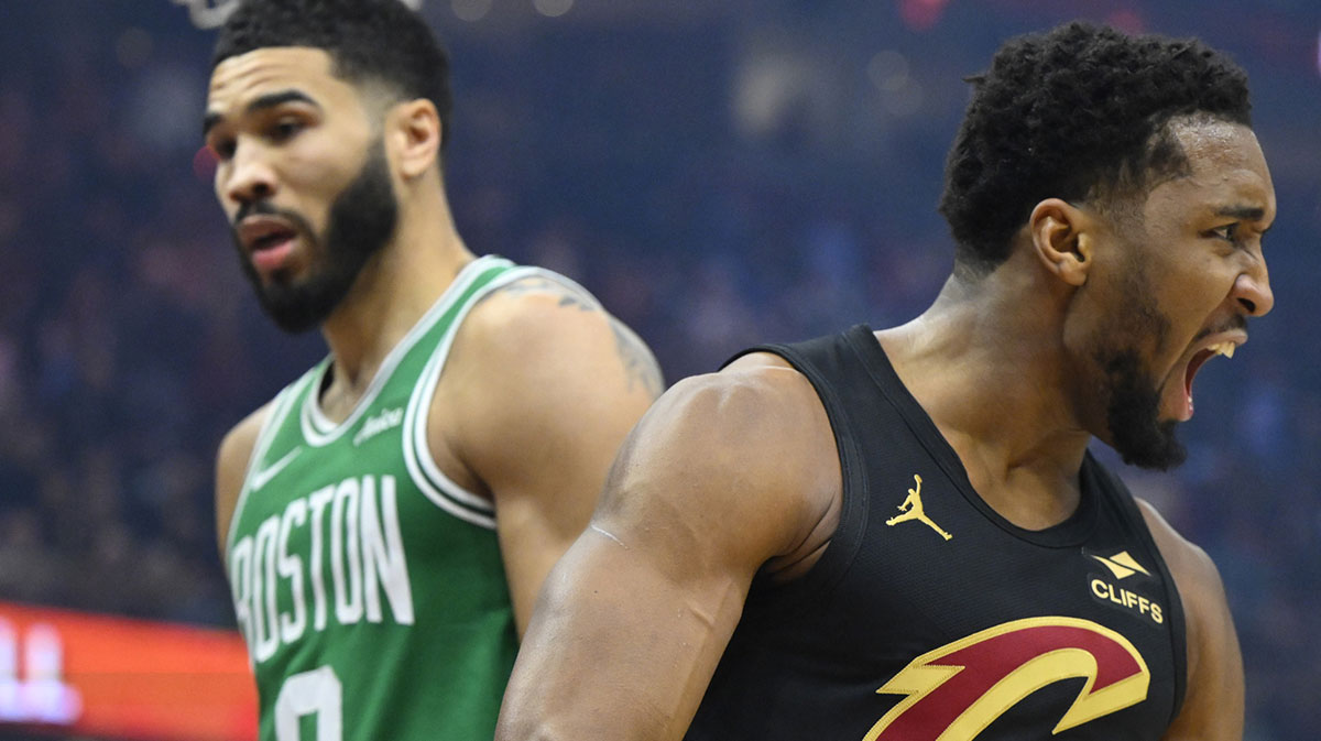 Cleveland Cavaliers guard Donovan Mitchell (45) celebrates beside Boston Celtics forward Jayson Tatum (0) in the first quarter at Rocket Mortgage FieldHouse.