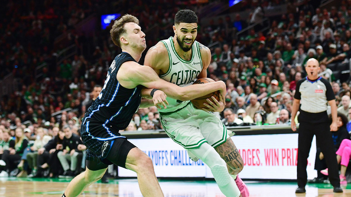 Orlando Magic forward Franz Wagner (22) tries to steal the ball from Boston Celtics forward Jayson Tatum (0) during the second half at TD Garden.