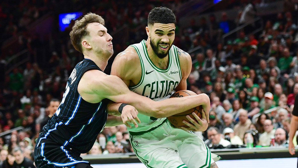 Orlando Magic forward Franz Wagner (22) tries to steal the ball from Boston Celtics forward Jayson Tatum (0) during the second half at TD Garden.