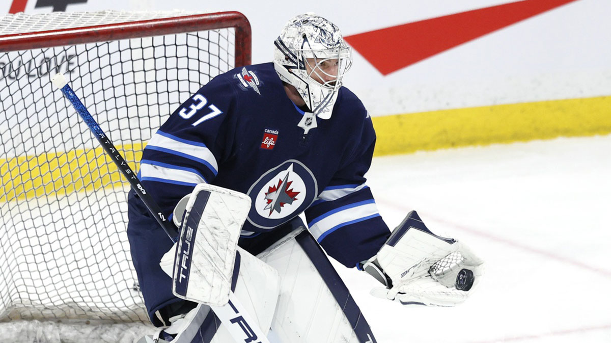 Winnipeg Jets goaltender Connor Hellebuyck (37) warms up before a game against the St. Louis Blues at Canada Life Centre