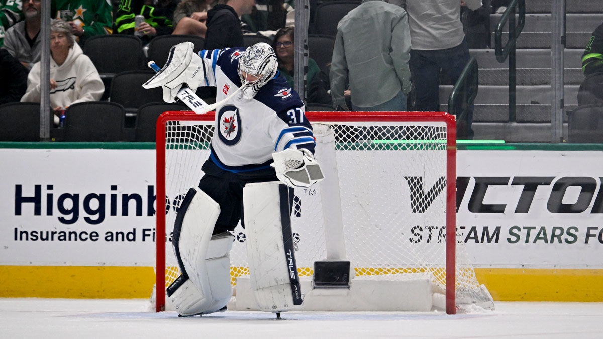 Winnipeg Jets goaltender Connor Hellebuyck (37) celebrates on the ice after getting the shutout win over the Dallas Stars at the American Airlines Center.