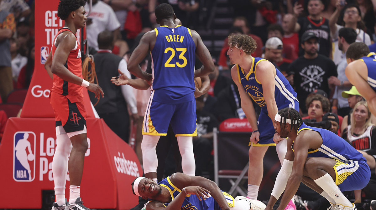 Golden State Warriors forward Jimmy Butler III (10) suffers an apparent injury during the first quarter during game two of the first round for the 2024 NBA Playoffs against the Houston Rockets at Toyota Center.