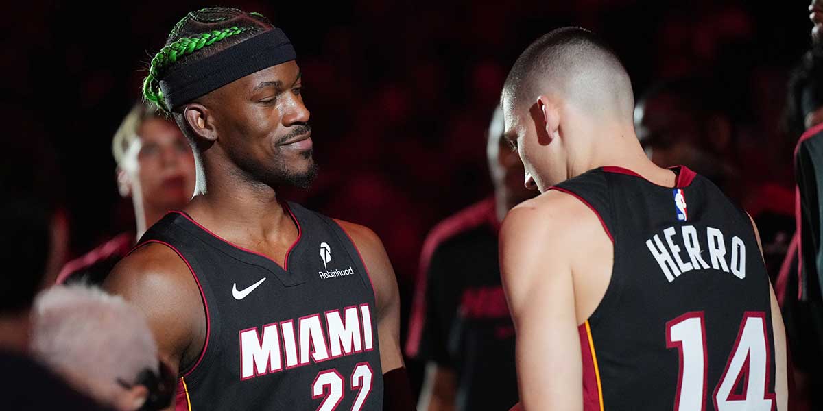 Miami Heat forward Jimmy Butler (22) and guard Tyler Herro (14) are introduced during pregame ceremonies before the game against the Indiana Pacers at Kaseya Center.