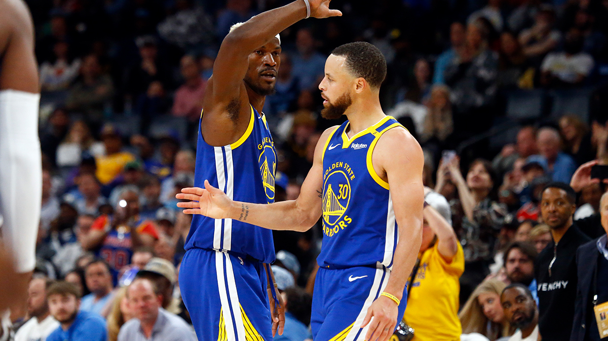 Golden State Warriors forward Jimmy Butler III (10) reacts with guard Stephen Curry (30) during the fourth quarter against the Memphis Grizzlies at FedExForum.