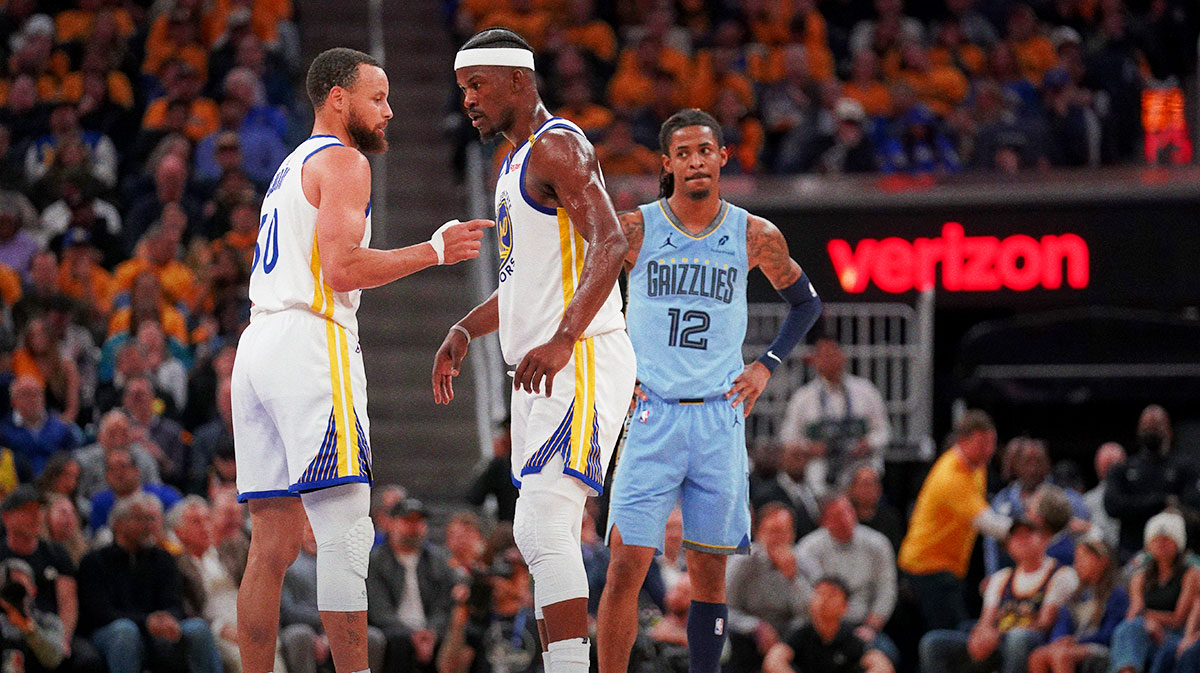 Golden State Warriors guard Stephen Curry (30) talks with forward Jimmy Butler III (10) during a break in the action against the Memphis Grizzlies in the second quarter at the Chase Center.