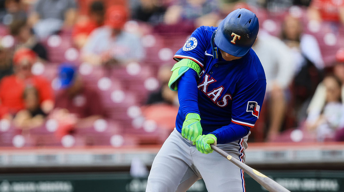 Apr 2, 2025; Cincinnati, Ohio, USA; Texas Rangers designated hitter Joc Pederson (4) hits a single in the fourth inning against the Cincinnati Reds at Great American Ball Park. Mandatory Credit: Katie Stratman-Imagn Images