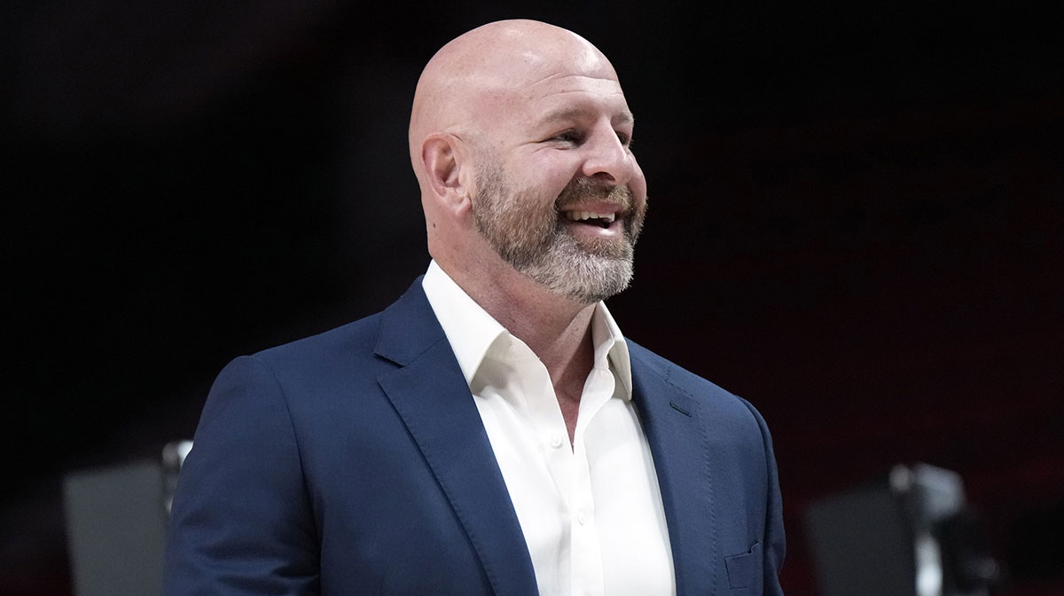 Portland Trail Blazers general manager Joe Cronin smiles as players warm up before a game against the New Orleans Pelicans at Moda Center.
