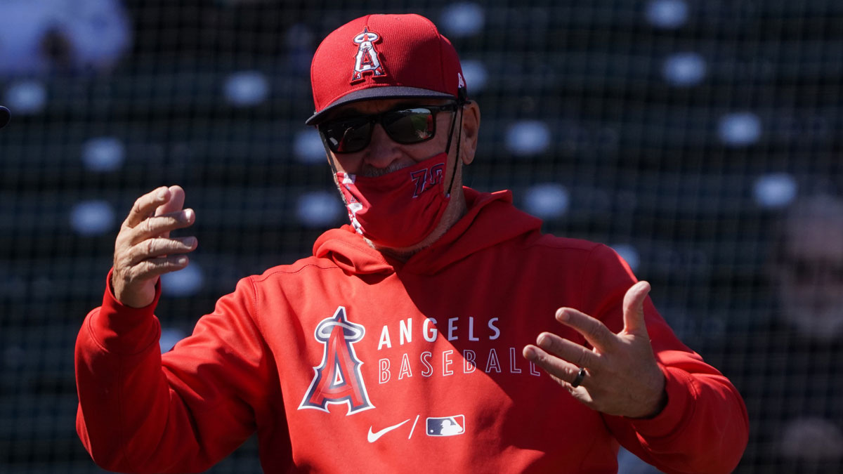 Mar 14, 2021; Mesa, Arizona, USA; Los Angeles Angels manager Joe Maddon (70) gestures before a spring training game against the Chicago Cubs.