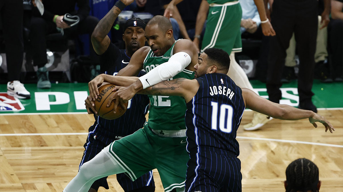 Boston Celtics center Al Horford (42) goes for a loose ball against Orlando Magic guard Cory Joseph (10) during the first quarter of game two of the first round of the 2024 NBA Playoffs at TD Garden.