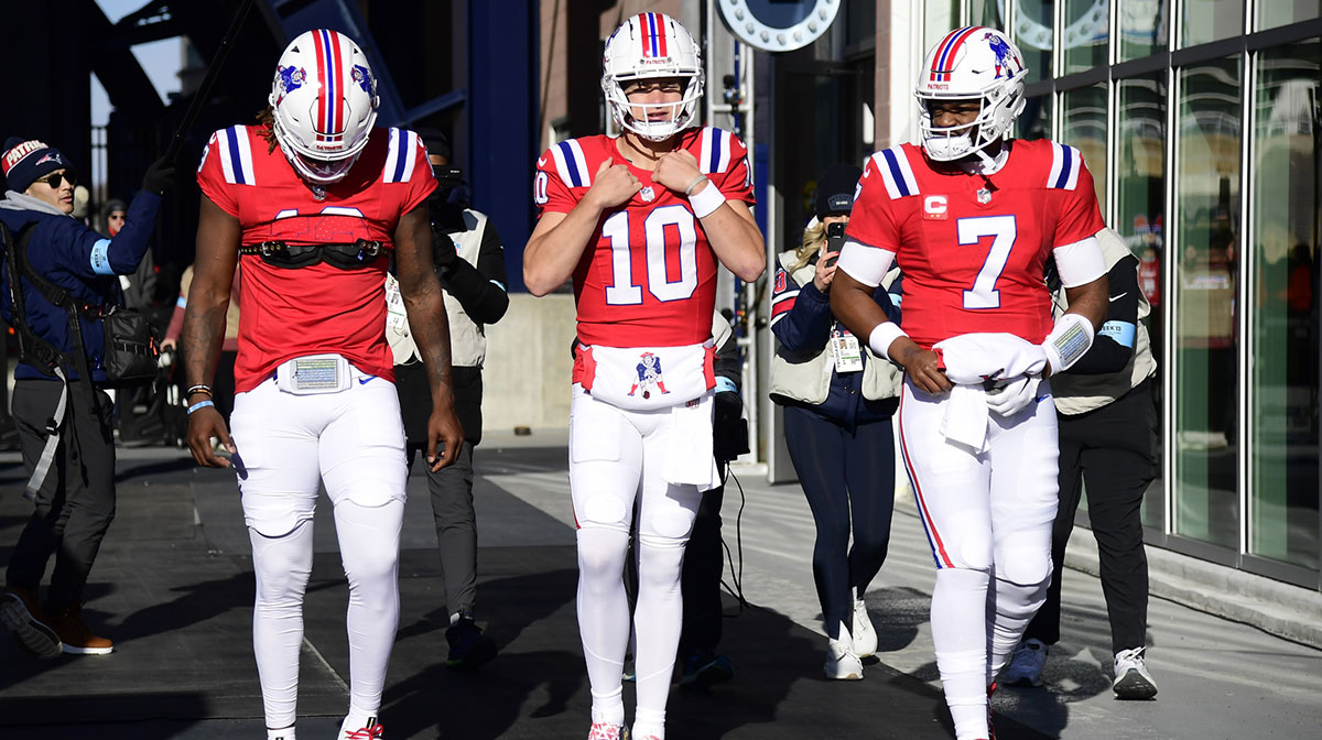 New England Patriots quarterback Joe Milton III (19) quarterback Drake Maye (10) and quarterback Jacoby Brissett (7) take the field for warmups prior to a game against the Indianapolis Colts at Gillette Stadium.
