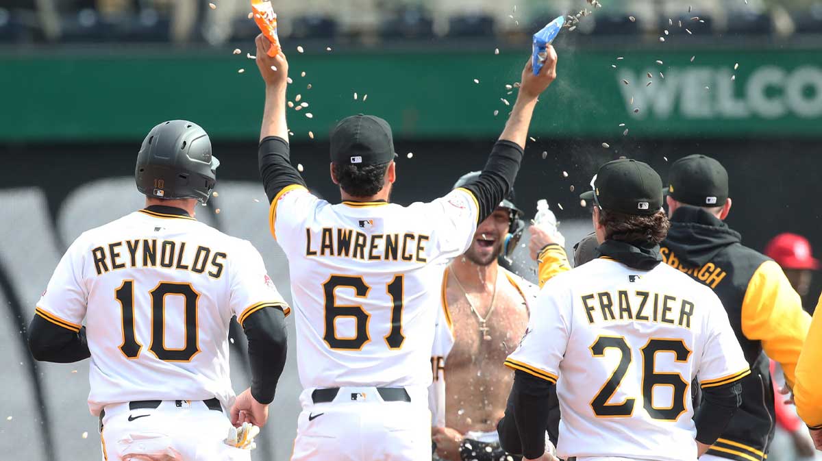 Pittsburgh Pirates teammates celebrate with catcher Joey Bart (shirtless) after Bart hit a game winning walk off single to defeat the St. Louis Cardinals in the thirteenth inning at PNC Park.