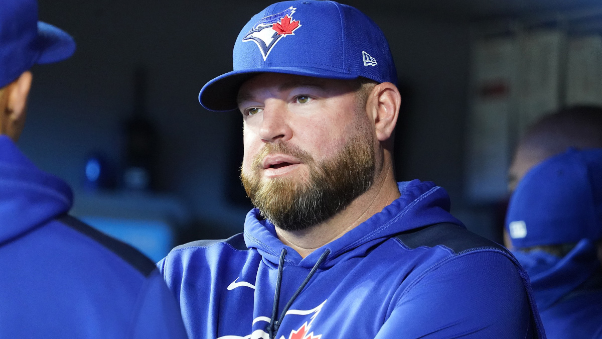 Toronto Blue Jays manager John Schneider talks with one of his assistant coaches before the start of the game against the Atlanta Braves at Rogers Centre.
