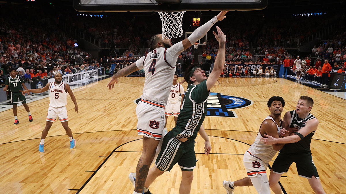 Michigan State Spartans forward Frankie Fidler (8) shoots against Auburn Tigers forward Johni Broome (4) during the second half in the South Regional final of the 2025 NCAA tournament at State Farm Arena.
