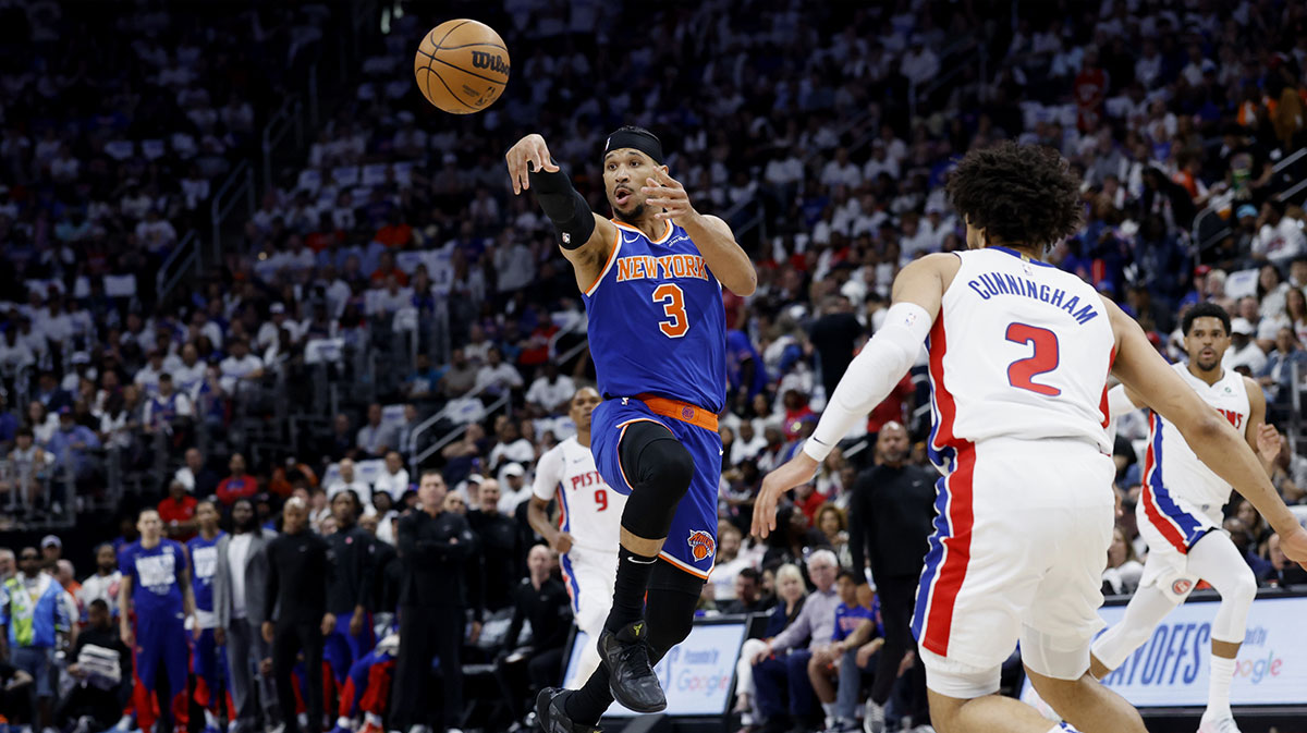 New York Knicks guard Josh Hart (3) passes on Detroit Pistons guard Cade Cunningham (2) in the first half during game three of first round for the 2024 NBA Playoffs at Little Caesars Arena.