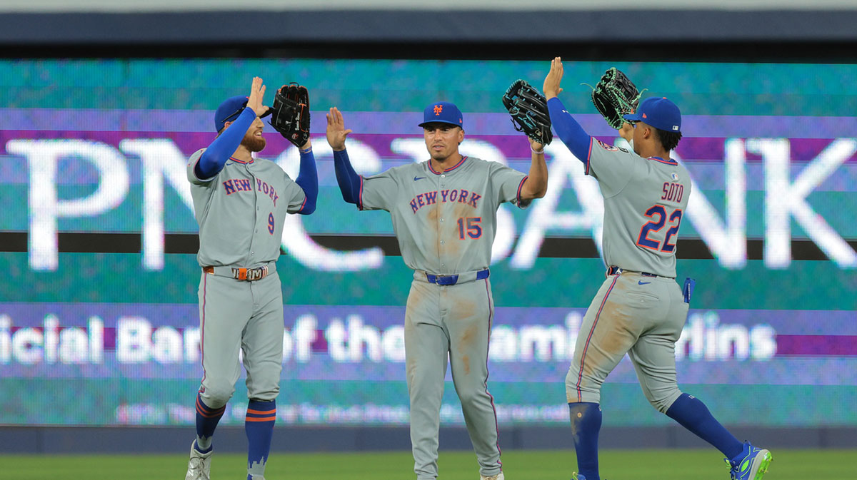 New York Mets left fielder Brandon Nimmo (9), right fielder Tyrone Taylor (15) and right fielder Juan Soto (22) celebrate after the game against the Miami Marlins at loanDepot Park.