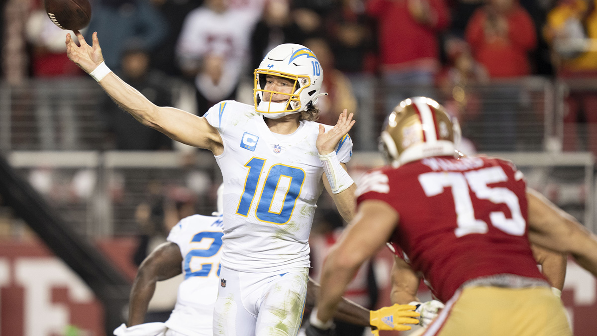 Los Angeles Chargers quarterback Justin Herbert (10) passes the football against San Francisco 49ers defensive end Jordan Willis (75) during the fourth quarter at Levi's Stadium.