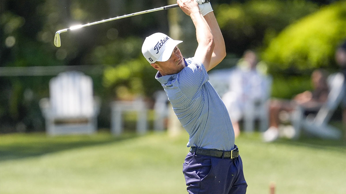Justin Thomas hits his approach shot to eight green during the first round of the RBC Heritage golf tournament