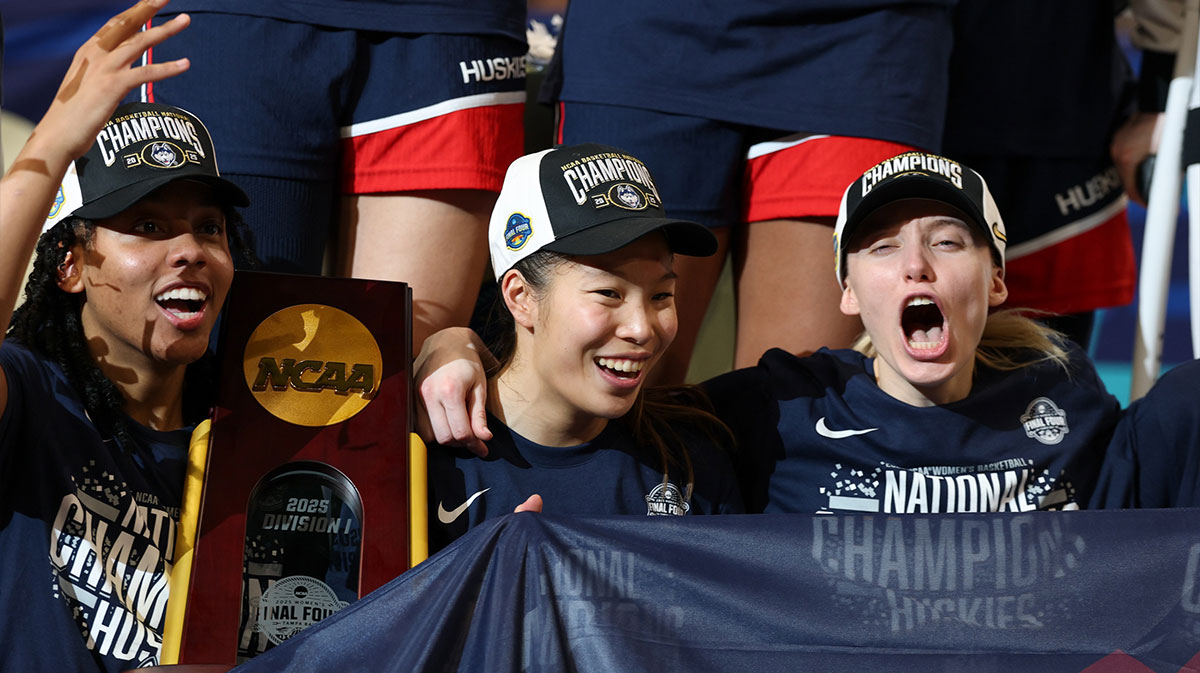 KK Arnold, guard Kaitlyn Chen, and guard Paige Bueckers after winning the National Championship, which former President Barack Obama congratulated the UConn Huskies for their March Madness win after the game.