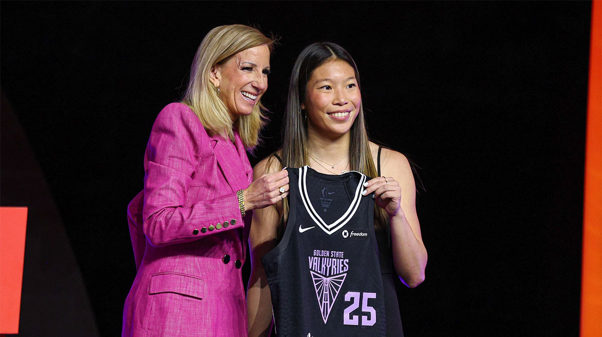 Kaitlyn Chen poses with WNBA commissioner Cathy Engelbert after being selected with the number thirty overall pick to the Golden State Valkyries