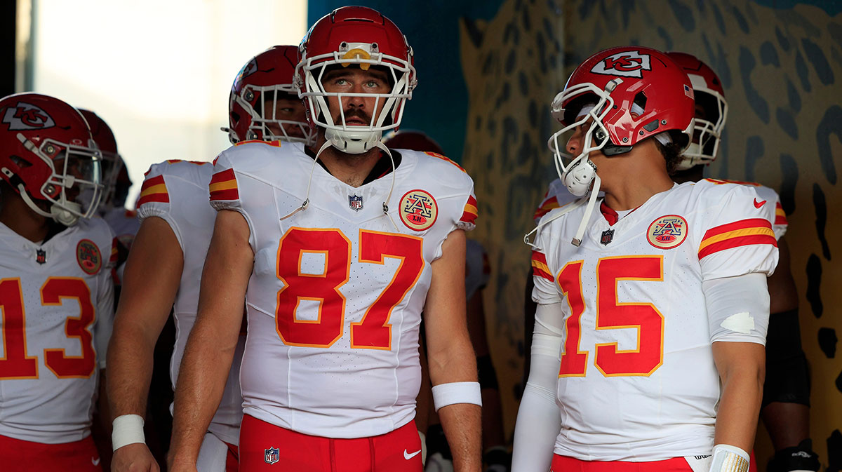 Kansas City Chiefs tight end Travis Kelce (87) looks on next to quarterback Patrick Mahomes (15) before a preseason NFL football game Saturday, Aug. 10, 2024 at EverBank Stadium in Jacksonville, Fla.