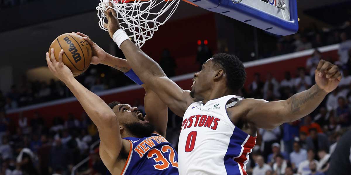 New York Knicks center Karl-Anthony Towns (32) shoots defended by Detroit Pistons center Jalen Duren (0) in the first half during game three of first round for the 2024 NBA Playoffs at Little Caesars Arena.