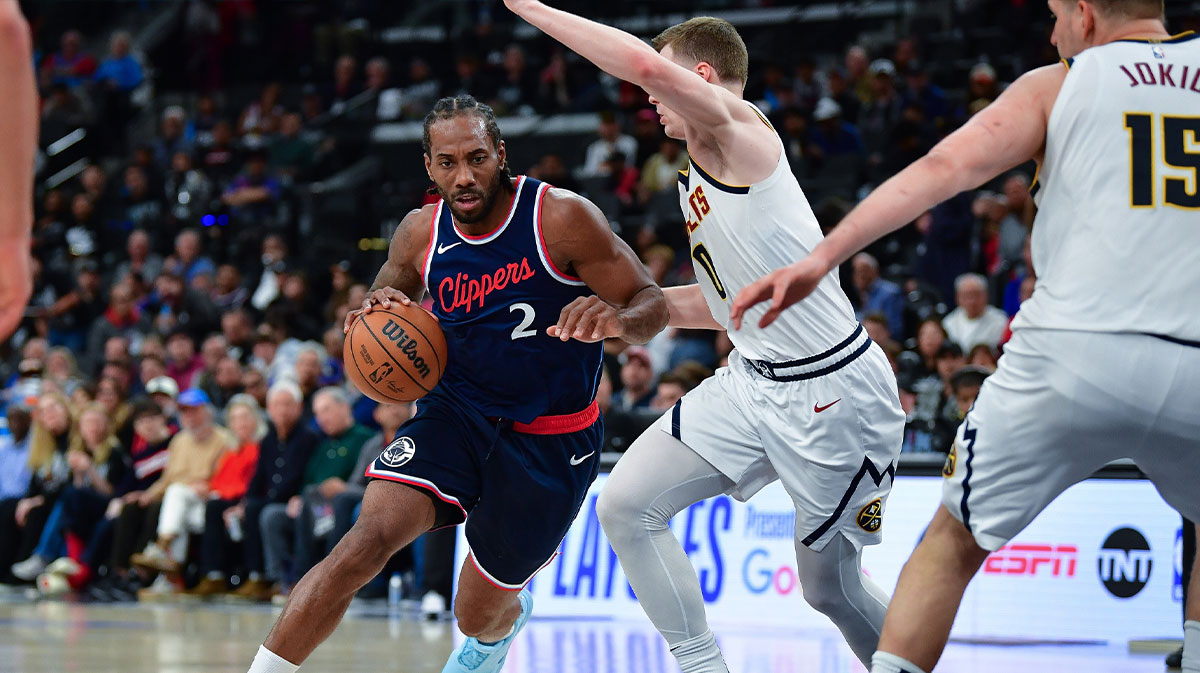 Los Angeles Clippers forward Kawhi Leonard (2) moves the ball against Denver Nuggets guard Christian Braun (0) during the second half of game three in the first round for the 2024 NBA Playoffs at Intuit Dome.
