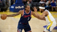 LA Clippers forward Kawhi Leonard (2) controls the ball against Golden State Warriors guard Moses Moody (4) during the third quarter at Chase Center.