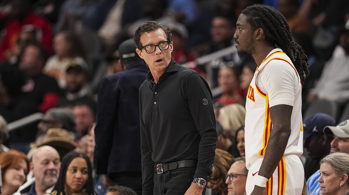 Atlanta Hawks head coach Quin Snyder reacts with guard Keaton Wallace (2) during the game against the Orlando Magic during the second half at State Farm Arena.