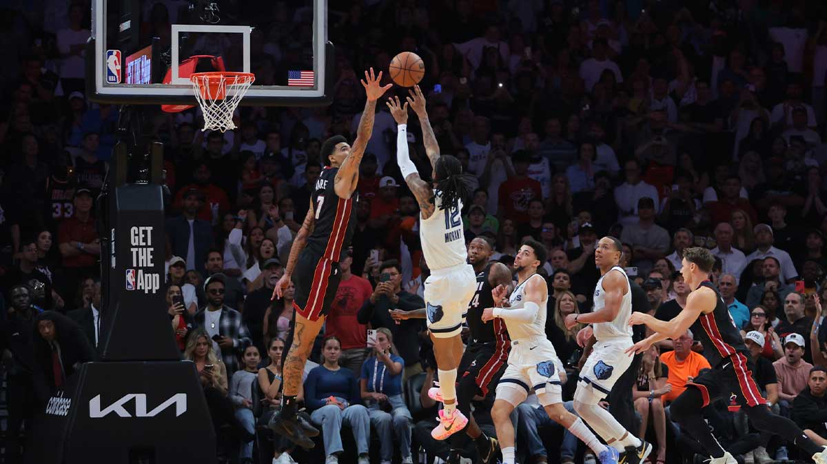 Memphis Grizzlies guard Ja Morant (12) shoots and scores the game-winning shot over Miami Heat center Kel'el Ware (7) during the fourth quarter at Kaseya Center.