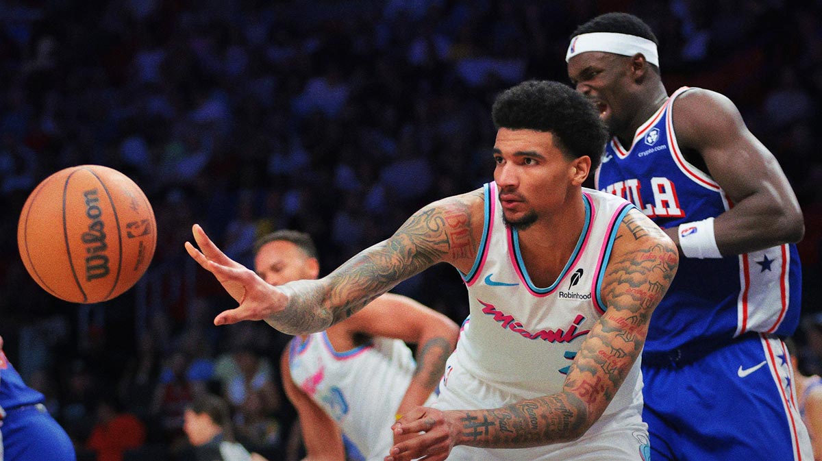 Miami Heat center Kel'el Ware (7) passes the ball after grabbing a rebound against the Philadelphia 76ers during the fourth quarter at Kaseya Center.