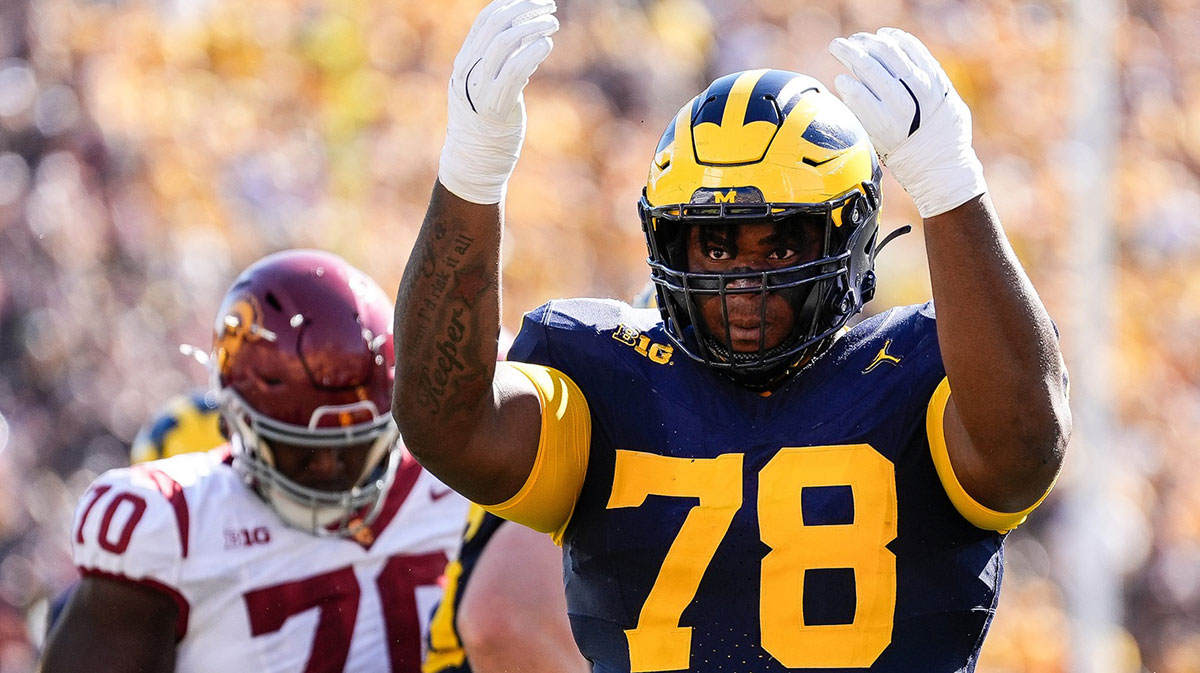 Michigan defensive lineman Kenneth Grant (78) celebrates a tackle against USC during the first half at Michigan Stadium