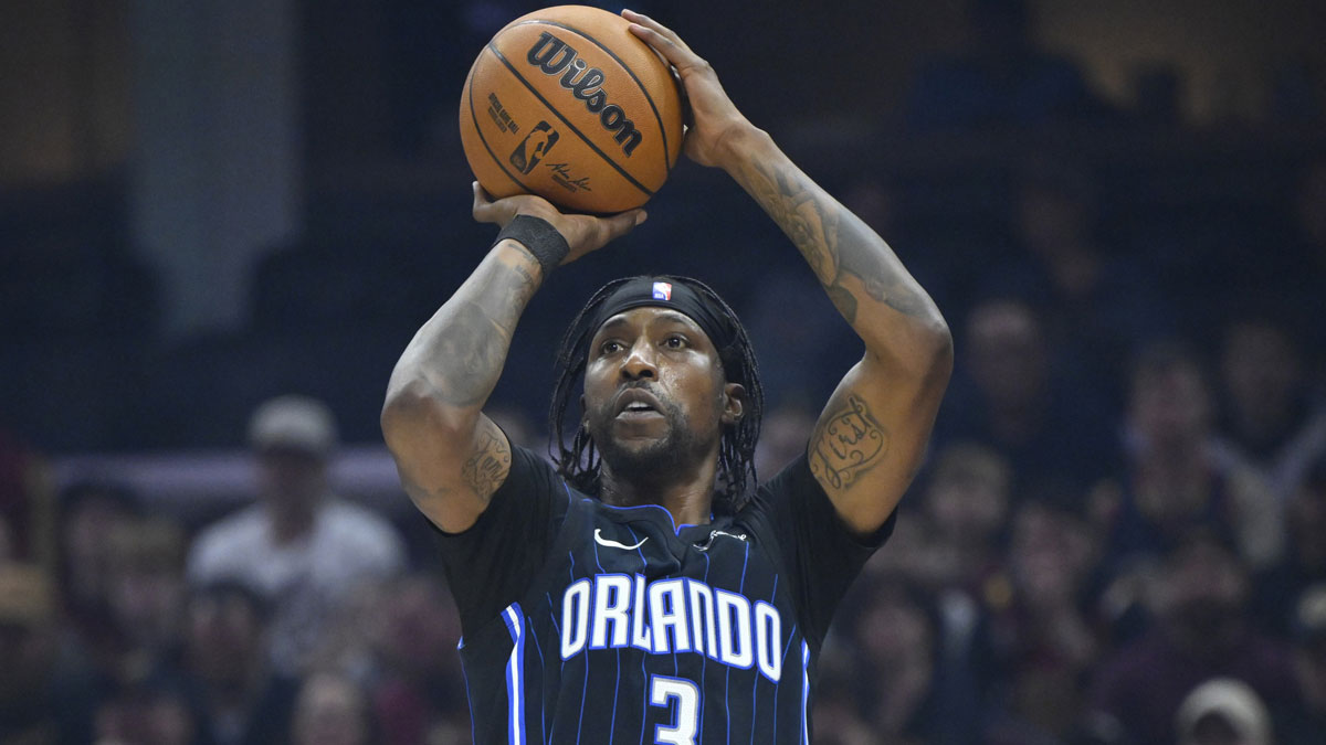 Mar 16, 2025; Cleveland, Ohio, USA; Orlando Magic guard Kentavious Caldwell-Pope (3) shoots in the first quarter against the Cleveland Cavaliers at Rocket Arena.