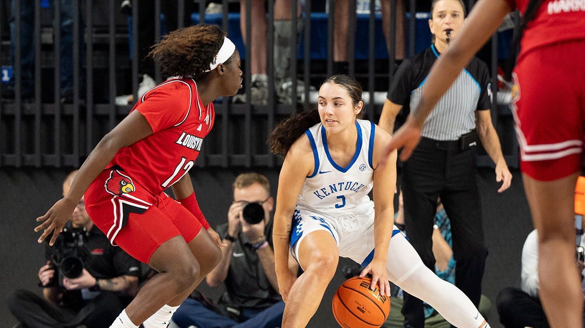 Kentucky guard Georgia Amoore (3) dribbles against Louisville guard Ja'Leah Williams (12) during a game on Nov. 16, 2024 at Memorial Coliseum in Lexington, Ky.