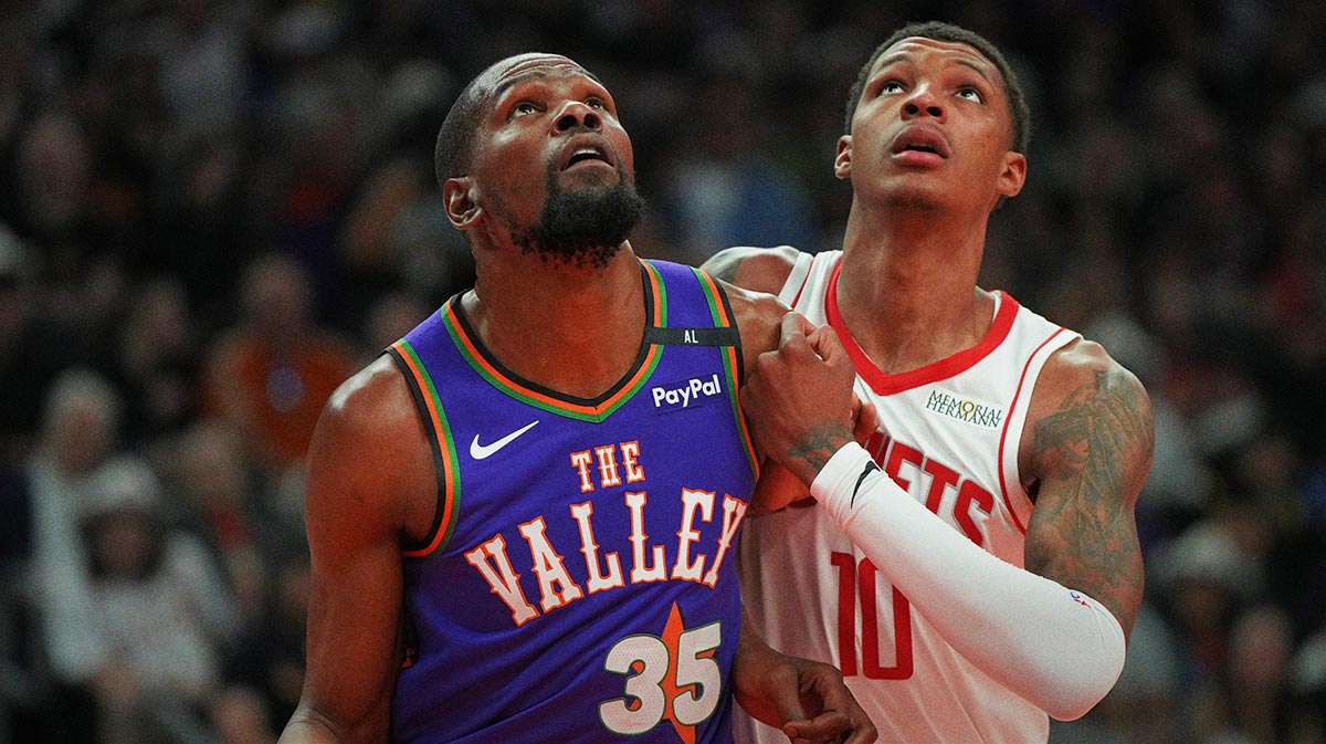 Phoenix Suns forward Kevin Durant (35) and Houston Rockets forward Jabari Smith Jr. (10) fight for position in the first half at Footprint Center.