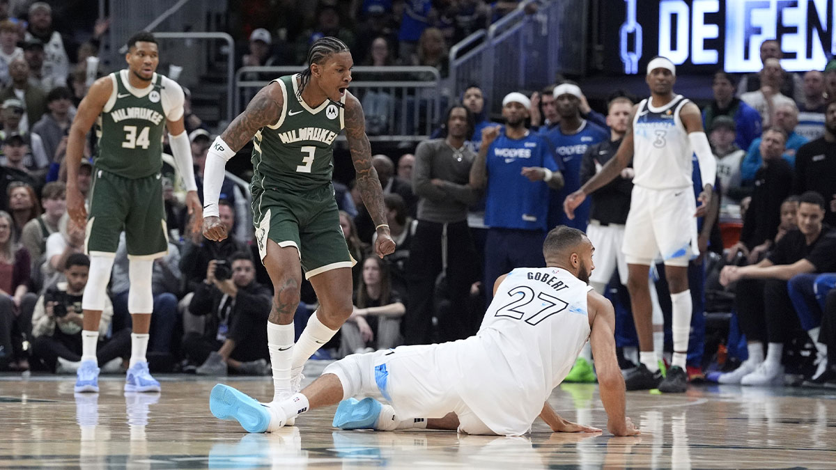 Milwaukee, Wisconsin, USA; Milwaukee Bucks guard Kevin Porter Jr. (3) and Minnesota Timberwolves center Rudy Gobert (27) in an altercation during the second half at Fiserv Forum.