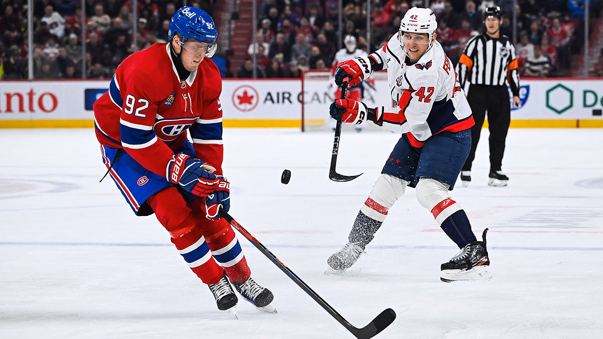 Washington Capitals defenseman Martin Fehervary (42) shoots the puck against Montreal Canadiens right wing Patrik Laine (92) during the first period at Bell Centre.
