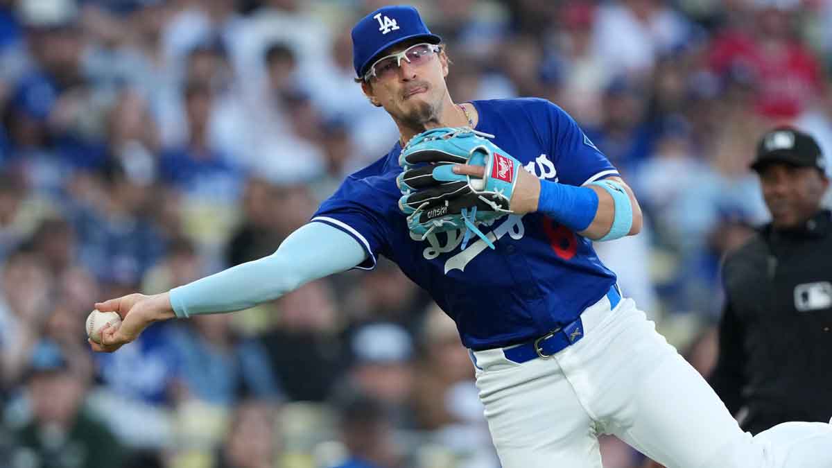 Los Angeles Dodgers third baseman Kike Hernandez (8) throws the ball to first base against the Los Angeles Angels at Dodger Stadium.