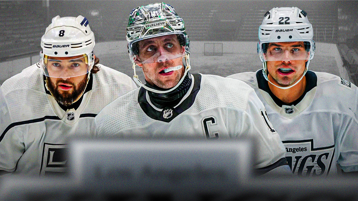 Anze Kopitar in middle, Kevin Fiala and Drew Doughty on either side, hockey rink in background