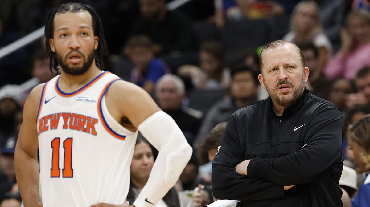 New York Knicks head coach Tom Thibodeau (R) and Knicks guard Jalen Brunson (11) look on during a stoppage in play against the Washington Wizards in the third quarterat Capital One Arena
